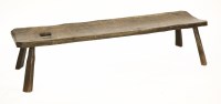 Lot 556 - An oak pig bench