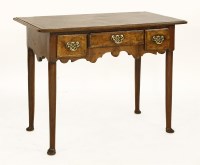 Lot 560 - A walnut lowboy