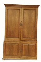 Lot 595 - An 18th century oak linen press