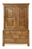 Lot 591 - An 18th century oak press cupboard