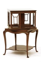 Lot 640 - An Edwardian square inlaid mahogany revolving bookstand