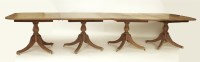 Lot 614 - A 20th century mahogany four pillar dining table