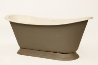 Lot 634 - A cast iron and enamel roll top bath