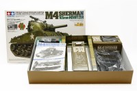 Lot 305 - A Tamiya 1/16 scale radio controlled M4 Sherman 105mm Howitzer tank