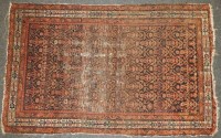 Lot 619 - An antique Persian navy blue ground rug