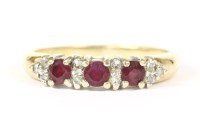 Lot 17 - A 9ct gold circular mixed cut ruby and diamond half hoop ring