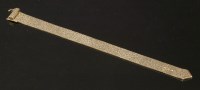 Lot 316 - A 9ct gold brick link jarretière bracelet
