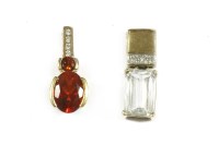 Lot 1 - A 9ct gold mixed cut pale blue/white topaz and cubic zirconia pendant