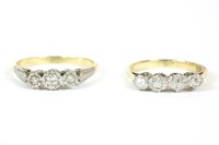 Lot 102 - A gold four stone illusion set diamond ring