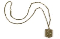 Lot 89 - A gold back and front shield locket