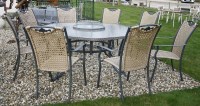 Lot 1038 - A large octagonal garden table and chairs