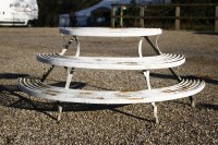 Lot 1092 - A wrought iron three tier plant stand