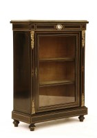 Lot 644 - An ebonised and inlaid pier cabinet