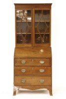 Lot 650 - A Georgian mahogany bureau bookcase