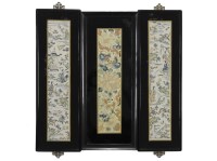 Lot 511 - A pair of Chinese embroidered silk panels depicting figures within a garden