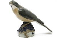 Lot 263 - A Royal Copenhagen bird standing on fruit