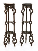 Lot 1298 - A pair of Chinese wood stands