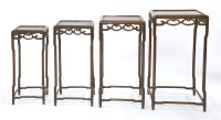 Lot 1335 - A Chinese hongmu nest of four square tables