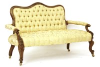 Lot 588 - A Victorian carved walnut settee