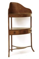 Lot 653 - A Georgian mahogany corner wash stand