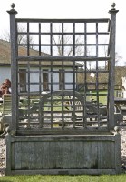 Lot 1133 - A modern teak trellis planter. 138cm wide x 216cm high