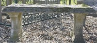 Lot 1135 - A composition stone garden seat
