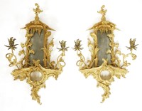 Lot 975 - A pair of rococo-style giltwood girandoles