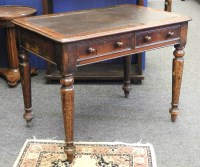 Lot 1104 - A late 19th century mahogany two drawer writing table