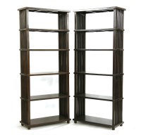 Lot 1112 - A pair of open shelves with lathe supports to either end