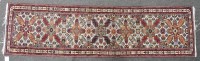 Lot 1062 - A Persian pale blue ground runner