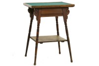 Lot 1049 - A Godwin style walnut occasional table
