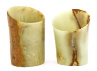 Lot 1474 - Two Chinese hoof-shaped tubular jades