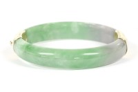 Lot 232 - A 'D' section jade hinge bangle
