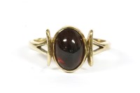 Lot 227 - A 9ct gold single stone garnet cabochon ring