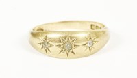 Lot 18 - An 18ct gold three stone diamond star set gypsy ring
4.61g