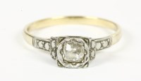 Lot 11 - A gold single stone illusion set cushion cut diamond ring