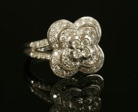 Lot 476 - A white gold diamond set cluster ring by Mauboussin