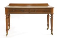 Lot 1141 - A Victorian mahogany side table on ring turned legs terminating on brass casters