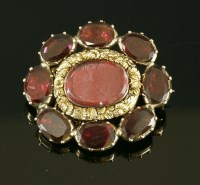 Lot 3 - A garnet set gold memorial brooch