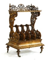 Lot 971 - A Victorian figured walnut Canterbury