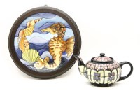 Lot 787 - A Moorcroft violet pattern teapot