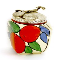 Lot 134 - A Clarice Cliff 'Orange' preserve pot and cover