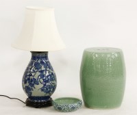 Lot 562 - An oriental celadon glaze porcelain garden seat