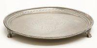 Lot 128 - A hallmarked circular silver salver on paw feet
