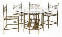 Lot 525 - A patinated bronze dining suite