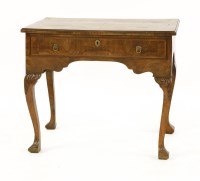 Lot 911 - A walnut side table