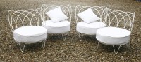 Lot 330 - A set of four wrought iron lounge chairs