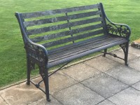 Lot 12 - A cast iron garden bench