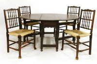Lot 686 - An oak gate leg table