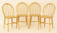 Lot 703 - Four Ercol beechwood single chairs
